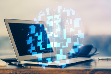 Double exposure of desktop computer and technology theme hologram. Concept of software development.