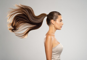 Profile portrait of a beautiful woman with a long straight  hair. © Valua Vitaly