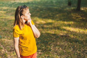 Fototapeta premium Student thinking with finger on her chin