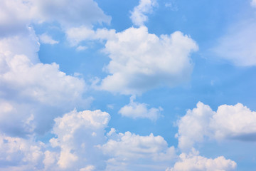 Fototapeta na wymiar Pastel blue sky with white heap clouds