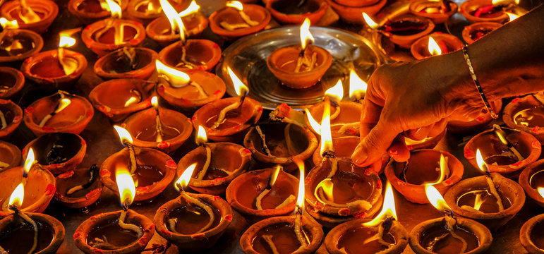 Woman making offering in the Sri Siva Subramania Swami Kovil Temple in Colombo, Sri Lanka.