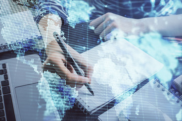 International business hud over woman's hands writing background. Concept of hard work. Double exposure