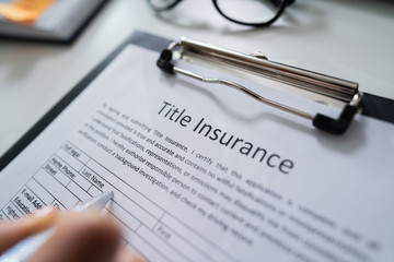 Woman Filling Title Insurance Form