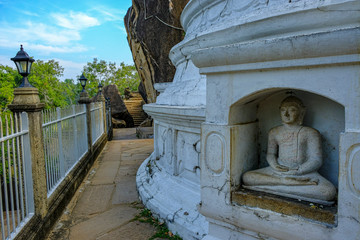 Anuradhapura, Sri Lanka - February 2020: Buddha statue in the stupa in the Isurumuniya Vihara Buddhist temple on February 6, 2020 in Anuradhapura, Sri Lanka.
