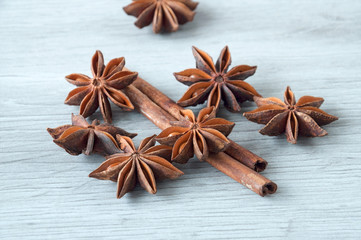 Cinnamon sticks and star anise close-up on a wooden background. Selective focus.