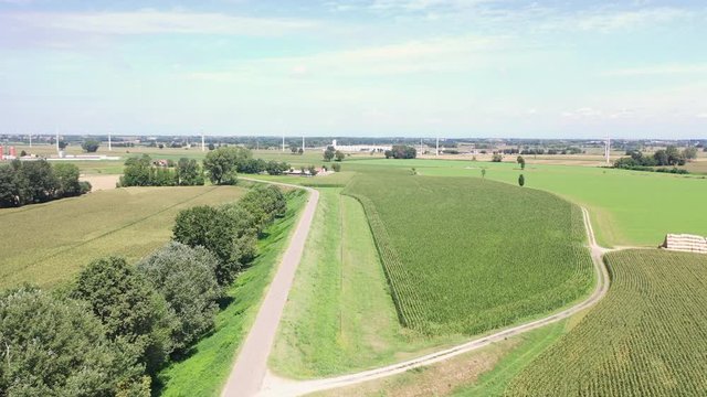 aerial view over green fields along the Po river next to Somaglia city, province of Lodi, Lombardy, Italy