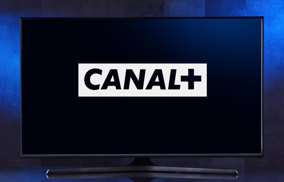 Flat-screen TV set displaying logo of Canal+