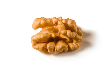 Still life with a walnut peeled on white background.