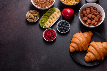 Delicious breakfast with fresh croissants and ripe berries