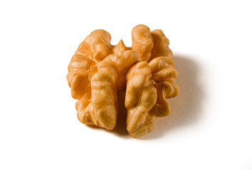 Still life with a walnut peeled on white background.