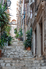 Fototapeta na wymiar Ancient street stair way perspective in old town of Dubrovnik