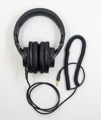 Headphones with coiled cable