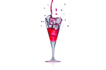 Ice in Glass champagne with red water, ice and red water red splash isolated onwhite background.