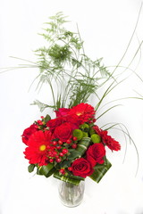 bouquet of red roses in a vase isolated on white