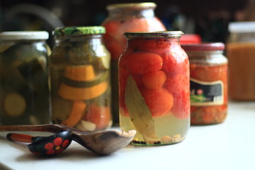 jars of pickles tomatoes and cucumbers