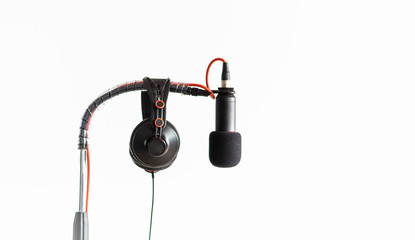High-quality Microphone and headphones on a white background.
