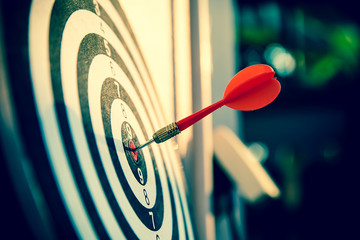 Close up red color arrow in the center of Bullseye or bull's-eye for business targeting and good...