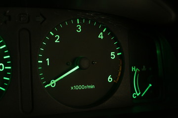 Car tachometer at night