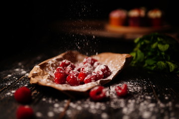 Raspberries in powdered sugar