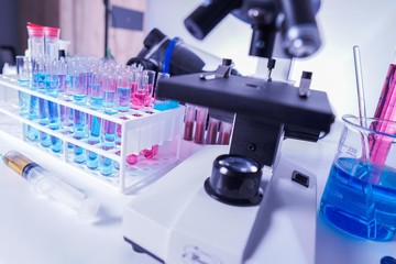 lab supplies glass test tubes, blood test tubes and microscope