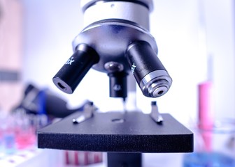 lab supplies glass test tubes, blood test tubes and microscope