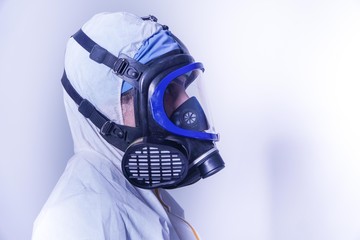 female doctor in protective suit and gas mask