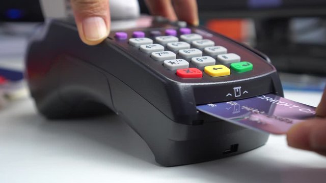 Credit card payment for purchase or sell products and service, business people hand pushing button or swipe to buy shopping through electronic transaction machine, Payments by credit card in terminal