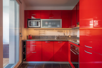 Paris, France - 08 26 2019: My lacquered red kitchen