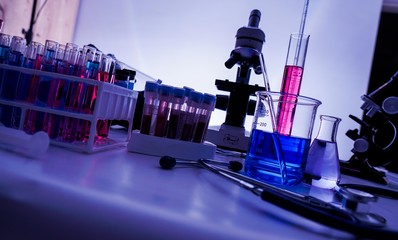 lab supplies glass test tubes, blood test tubes and microscope