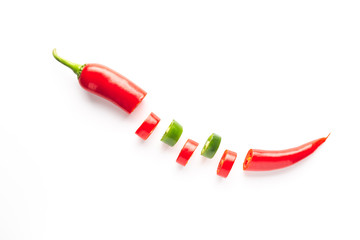 Red and green chili pepper sliced ​​on white background. .Gastronomy and cooking condiments.