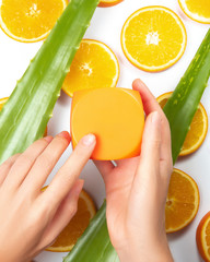 Natural cosmetics mockup jar in hands