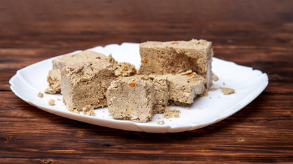 Halva in the billy tarіltsі on the dark wooden table_