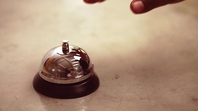Slow motion close up scene of the man walking to press the bell button.
