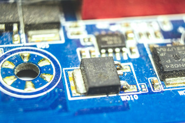 Electronic microcircuit transistors circuit board with diodes close-up. Macro photo