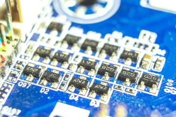 Electronic microcircuit transistors circuit board with diodes close-up. Macro photo