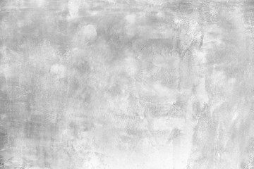 Raw old cement concrete or plaster wall with stains and cracks for background and texture.