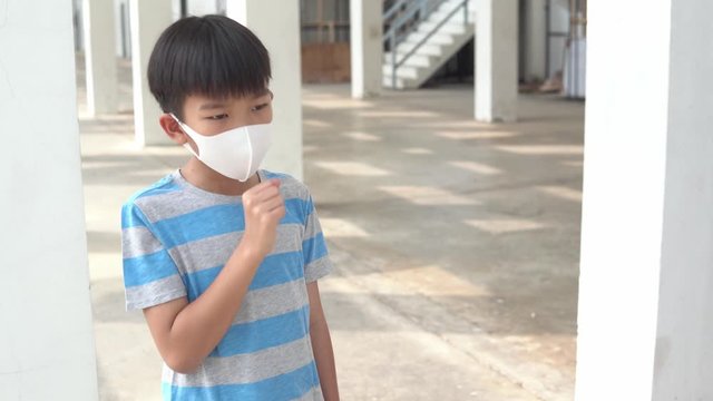 4k Move camera around young asian boy with face mark get caugh