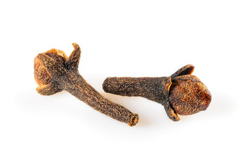 Cloves spice. Two dried cloves, macro close-up Isolated on white background, with light shadow.