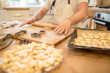 Young man bakes cookies
