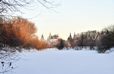 winter frosty morning with a view of the lake and the ancient fortress