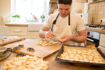 Young man bakes cookies