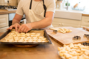 Young man bakes cookies