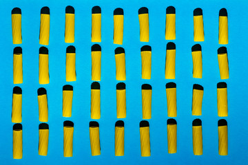Macaroni is arranged in rows on a blue background