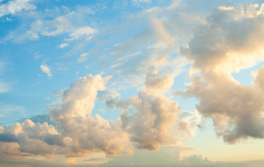Fototapeta na wymiar Blue sky clouds background. Beautiful landscape with clouds and orange sun on sky