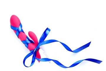 Sex toy for adult, design pink vibrator with a blue gift ribbon isolated on white background....