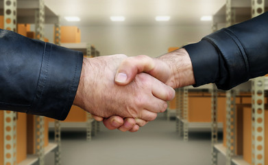 Two men shake hands confirmation of the transaction.