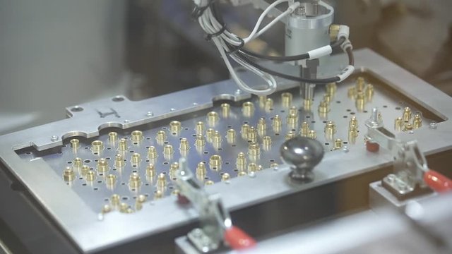 Close-up Macro Shot of Electronic Factory Machine at Work. Pich and Place Mashine