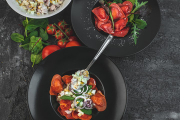 red, tomato-shaped heart-shaped ravioli, with the addition of an Italian salad