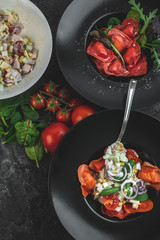 red, tomato-shaped heart-shaped ravioli, with the addition of an Italian salad
