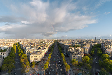 Aerial view of Paris City and the Avenue des Champs-Élysées with a rainbow among the city